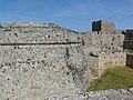 The Tower of St. John at the east end of the English sector. The tower was built under Grand Master Antonio Fluvian (1421–1437), and it had a gate. Later a barbican was built around it under Grand Master Piero Raimundo Zacosta (1461–1467). Finally the large pentagonal bulwark was built in front of it c. 1487, and the gate was removed.