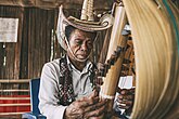 Sasando, a traditional stringed instrument from East Nusa Tenggara. It features a resonating body made from palm leaves and multiple strings that create a rich, harmonious sound.