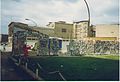 damaged wall at Checkpoint Charlie, July 1990