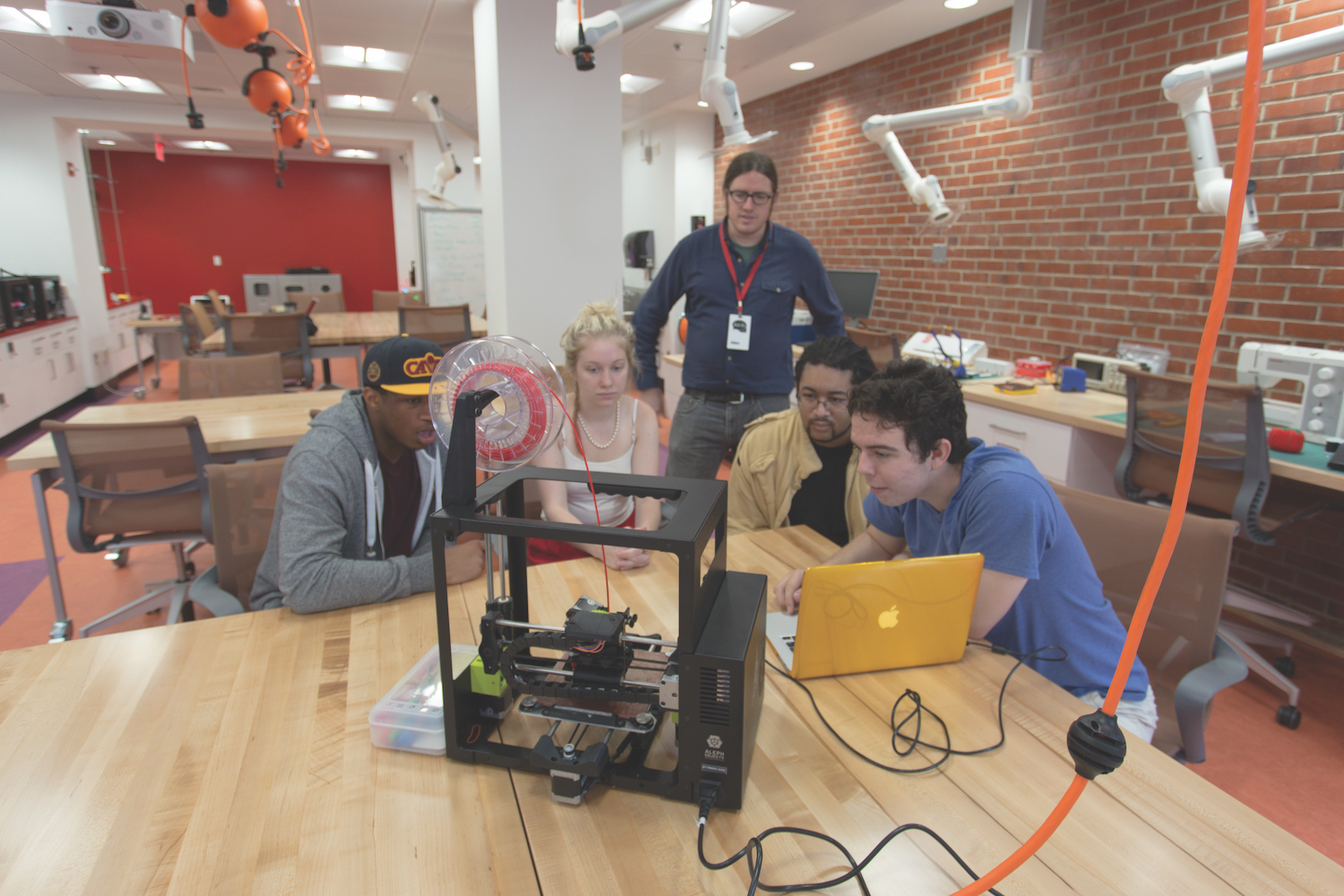 Students working with electronics and craft materials