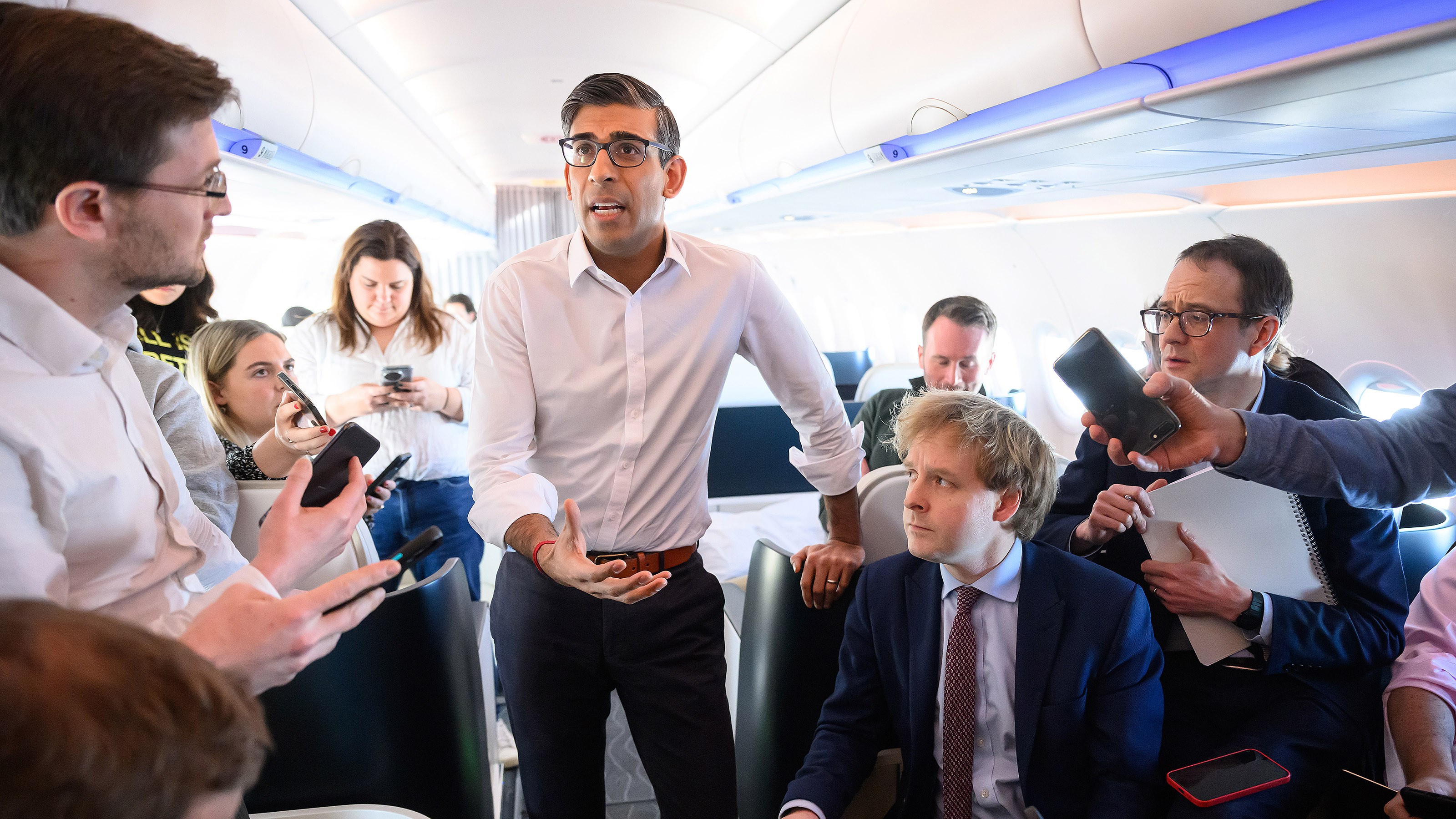 Rishi Sunak speaks with reporters on a flight to San Diego, where he will meet President Biden and Anthony Albanese, Australia’s prime minister, and announce the new submarine programme