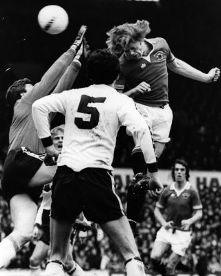 Gordon McQueen in action for Manchester United against Liverpool in 1983