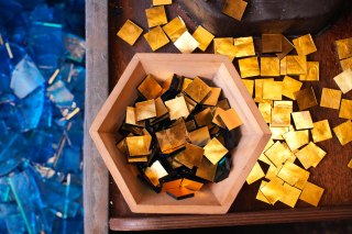 Squares of 24-carat gold leaf are brushed onto the Orsoni glass