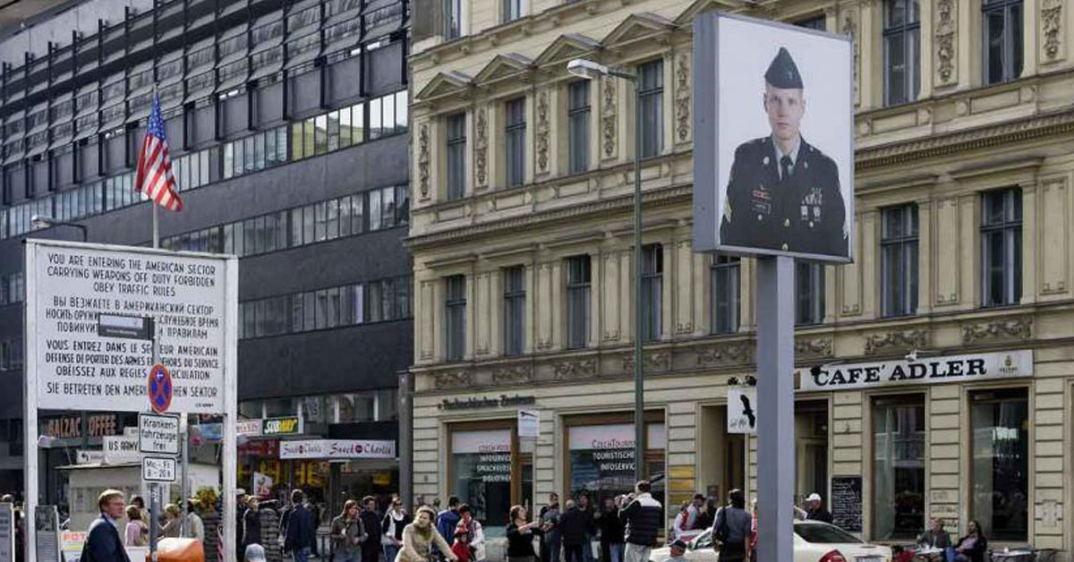 This real soldier’s photo is still hanging at Checkpoint Charlie