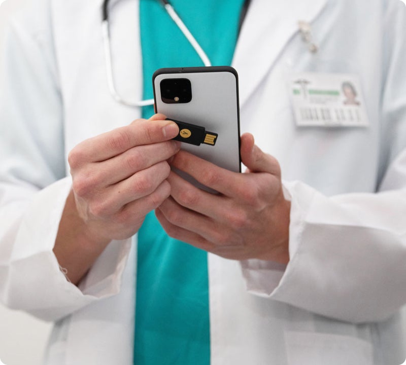 healthcare worker using yubikey